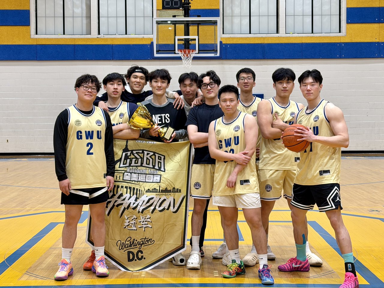 Adam Zhang and his GWU teammates with the CSBA Washington D.C. championship trophy and banner