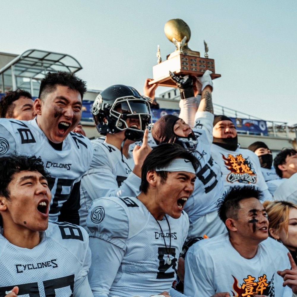 The Beijing Cyclones lifting the national championship trophy