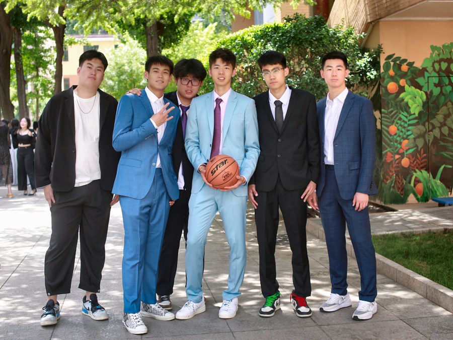 Adam Zhang with his high-school basketball team on graduation day