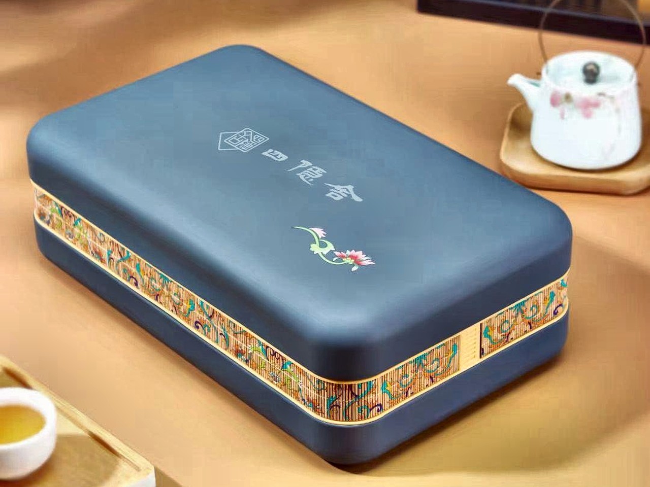 The Siyinshe Fenghuang Dancong premium gift box, slate blue with a brocade band