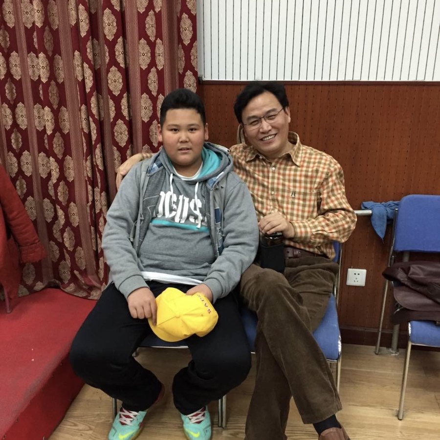 Adam Zhang in a trumpet lesson as a boy