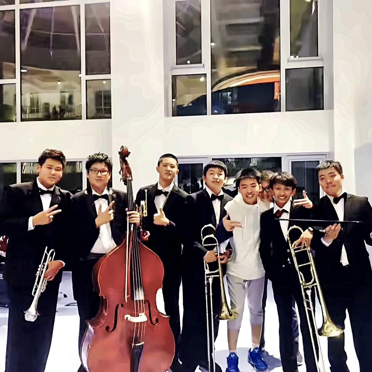 Adam Zhang with the brass section of his wind band after a concert